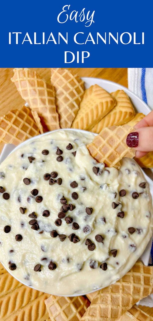 a white bowl is filled with cannoli dip and there are cookies around the bowl. a cookie is dipped.