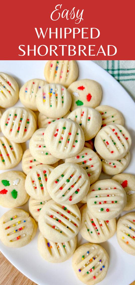 a white platter is filled with whipped shortbread cookies that are topped with sprinkles