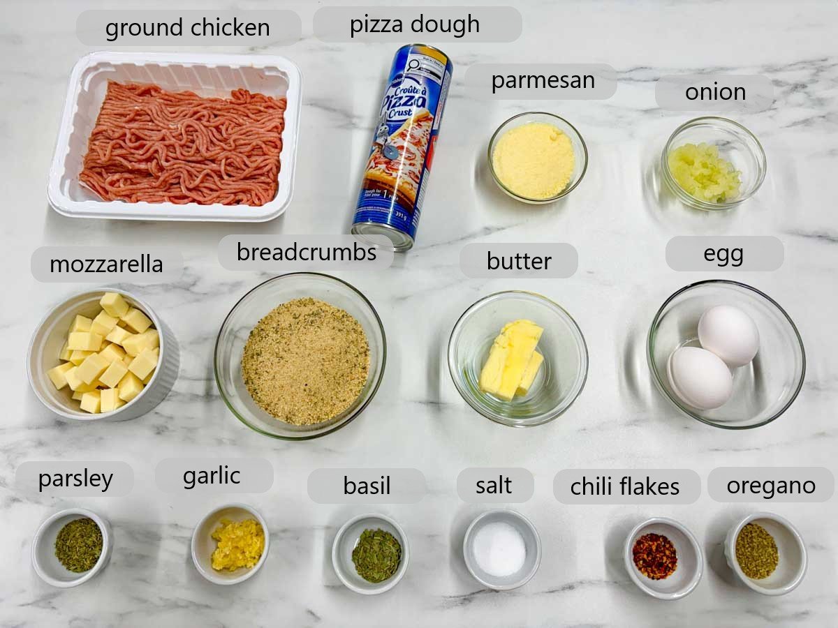 a kitchen counter with bowls of the ingredients to make chicken parmesan meatball subs on a stick