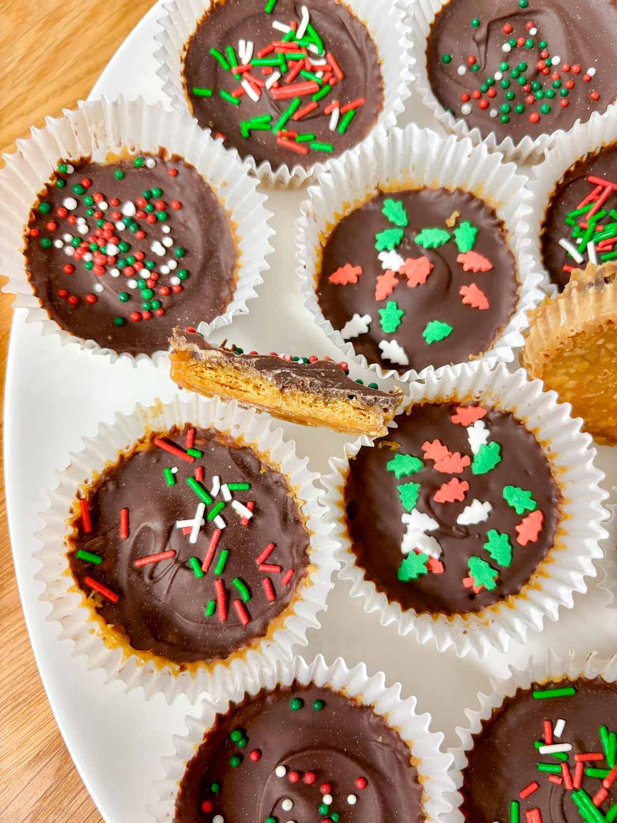  white platter is filled with Christmas crack cookies.