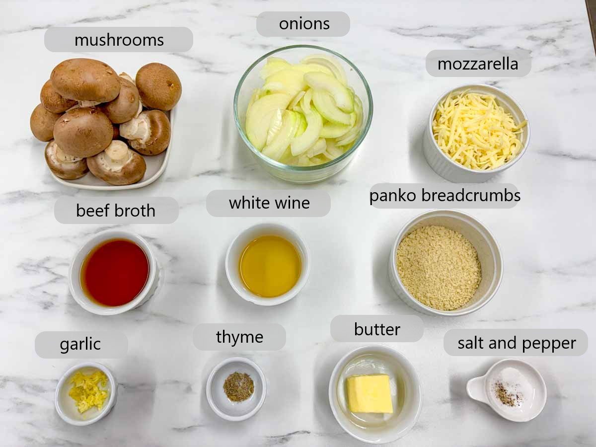 counter top with bowls with ingredients and text overlays reading mushrooms, onions, mozzarella, beef broth, white wine, panko breadcrumbs, garlic, thyme, butter, salt and pepper