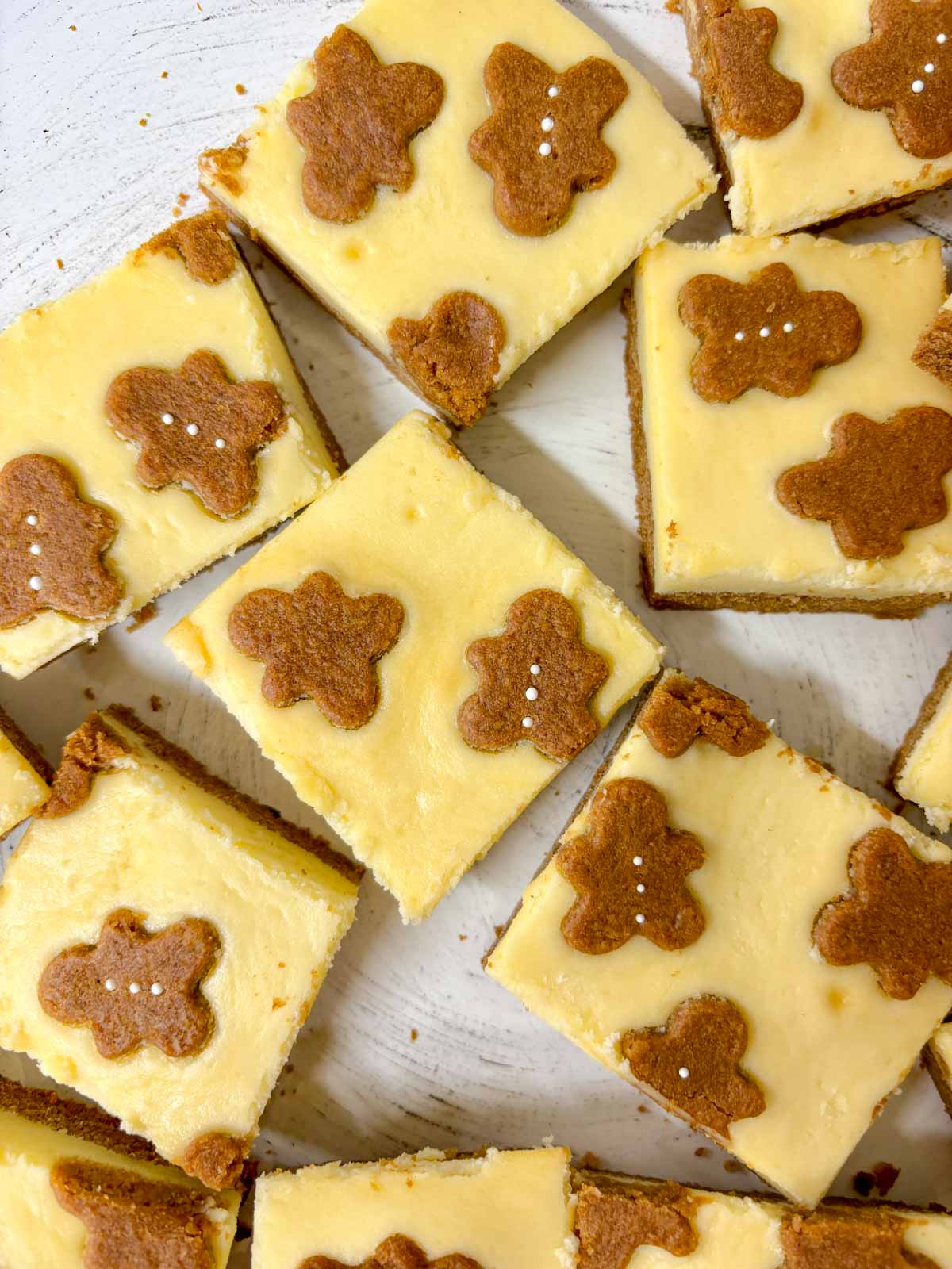 a white plate is filled with gingerbread cookie bars.