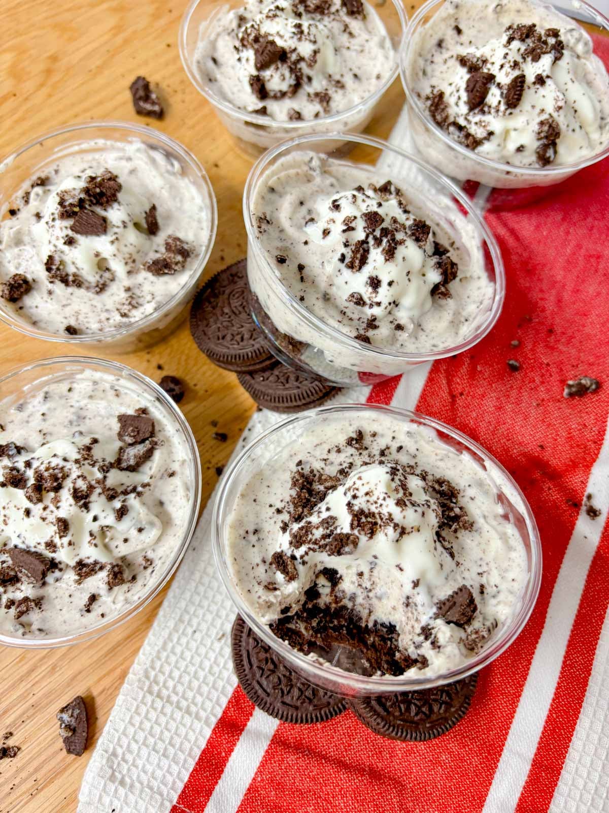 no bake oreo cheesecake cups on a kitchen counter