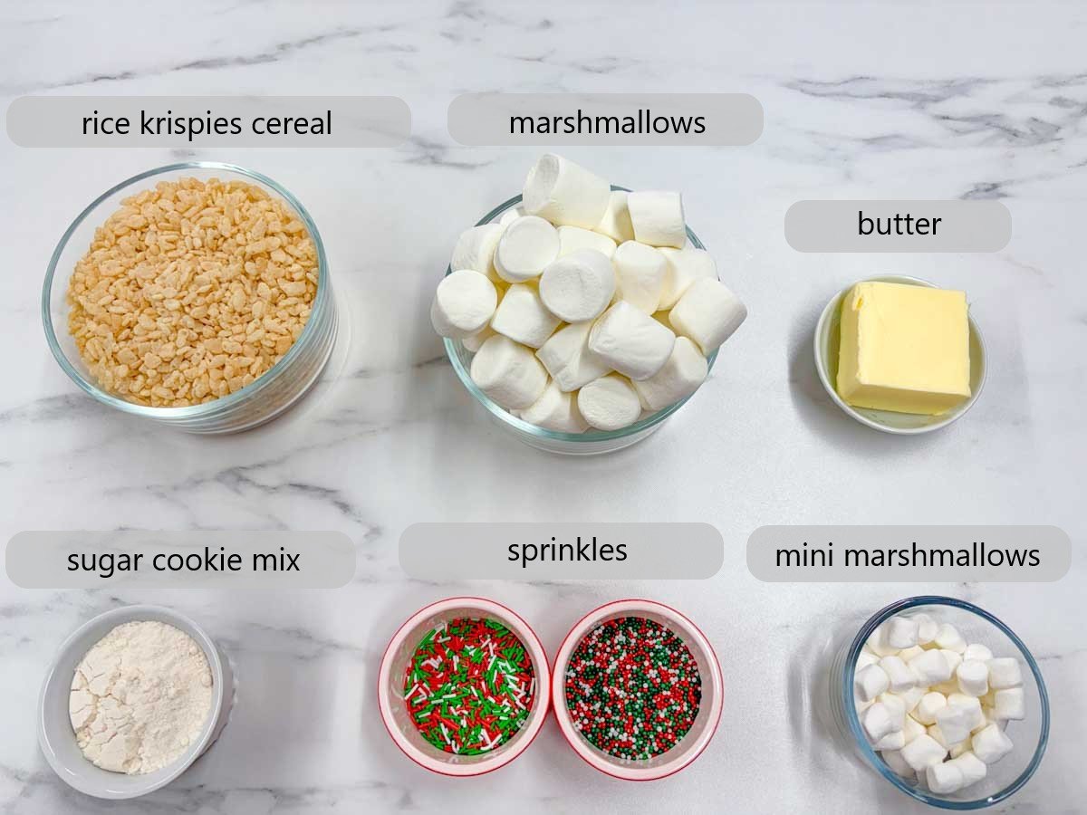 kitchen counter with bowl and ingredients and text overlays reading rice krispies cereal, marshmallows, butter, sugar cookie mix, sprinkles, and mini marshmallows