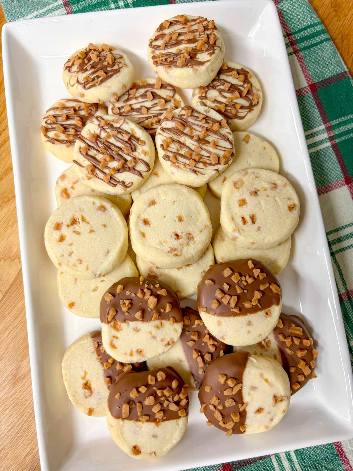 a white plate is filled with toffee shortbread cookies